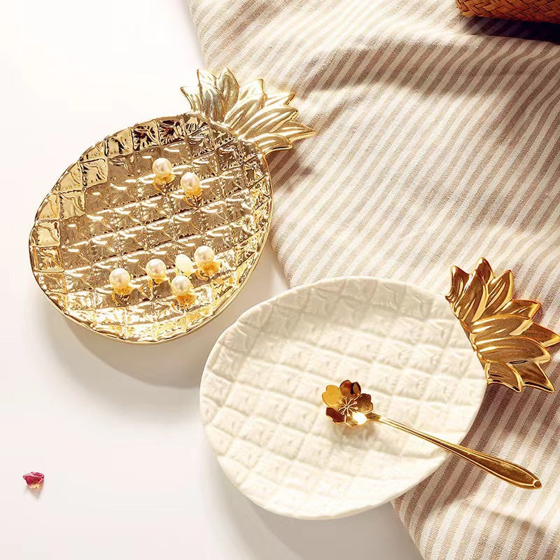 Luxury gold pineapple decorative tray used as a jewelry dish and tropical home decor accent